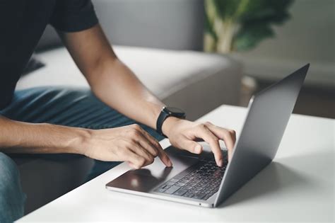 Premium Photo Man Using A Laptop Computer To Searching For