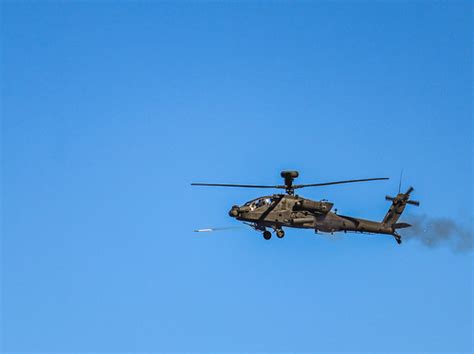 A Us Army Ah 64 Apache Attack Helicopter Fires An Aerial Flickr