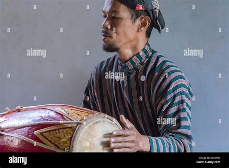 Man Playing Traditional Gamelan Drums In Magelang Borobudur Java