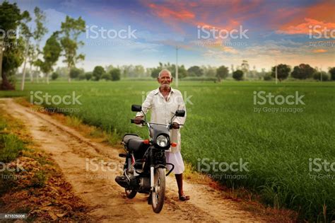 Old Man Riding Motorcycle In Green Field Stock Photo Download Image