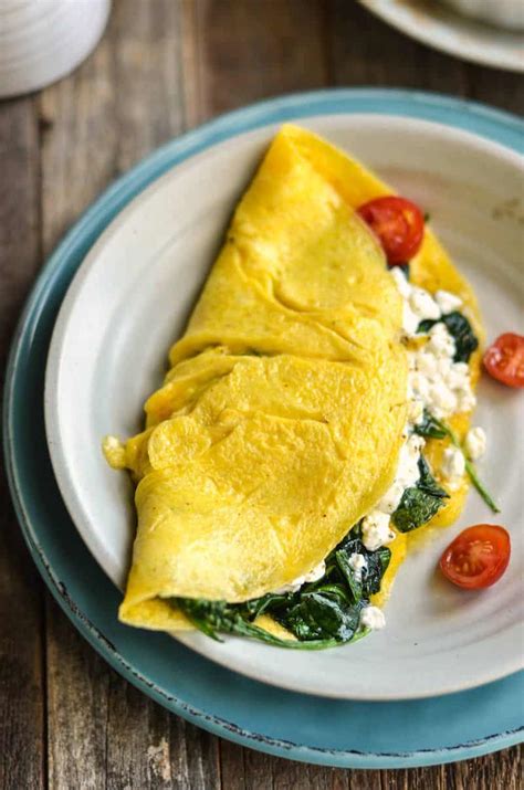 In eggs gradually pour in the milk, beat the weight before it becomes a smooth paste, add salt, cheese, grated on a fine grater, and all it gently mix. Veggie and Cottage Cheese Omelette Recipe | Skip To My Lou