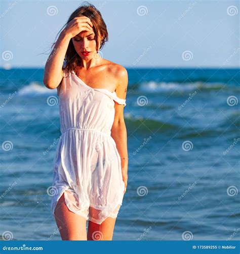 Woman In White Wet Dress Posing In A Sea Waves Stock Image Image Of Lifestyle Happy