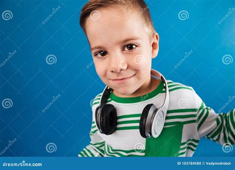 Close Up Image Of Smiling Young Boy Posing With Headphone Stock Photo
