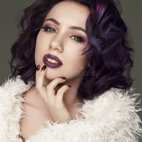 Portrait Of Young Beautiful Woman With Violet Make Up And Purple Stock