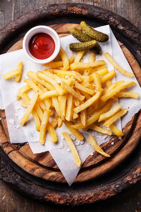 Salted French Fries With Ketchup Food And Drink Photos On Creative Market