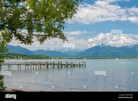 Lake Chiemsee Jetty At The Village Chieming With The Alps In