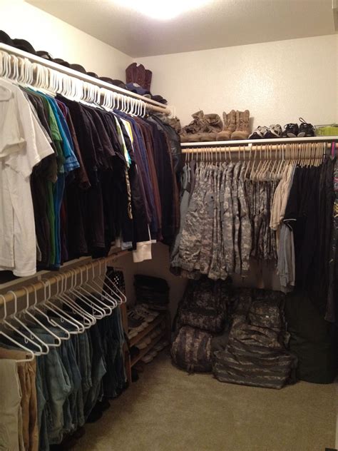 The first step to sharing is to have a clear division of space. Husband's side of our closet. ACUs, Army gear, hats and ...