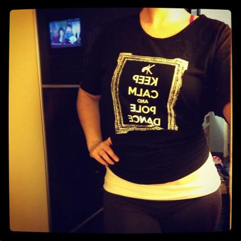 our comfy tee with our keep calm and pole dance artwork shown tied behind the back in a mirror