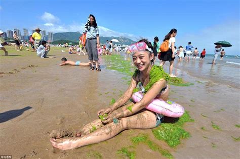 Chinese Beach Goers Use Green Algae As Sunblock In Bizarre Trend