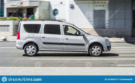 Lada Largus Driving On The Highway Road Silver Mpv Car With Spacious