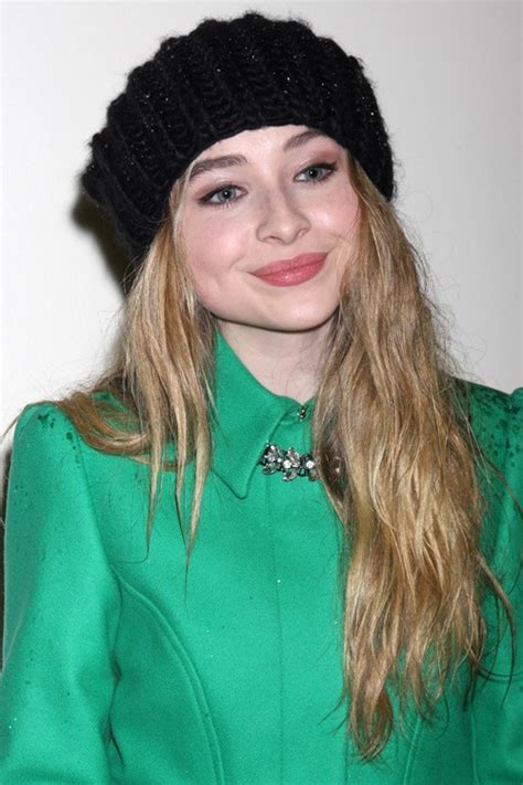 sabrina carpenter wavy honey blonde faux sidecut side part hairstyle steal her style