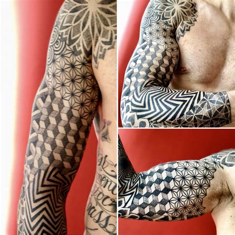 A Mans Arm And Shoulder Covered In Black And White Geometric Tattoos