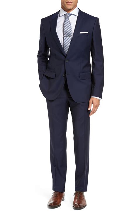 Sharpen up those edges with a slim suit jacket and trousers for a formal look that ticks all the boxes, or take the more casual route with a tapered smart trouser offering. BOSS Huge/genius Trim Fit Navy Wool Suit in Blue for Men ...