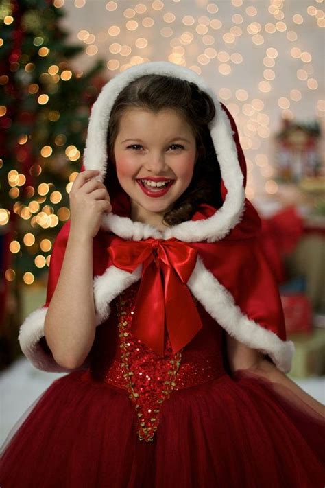 Red christmas present on a blurred golden background. Christmas Girls Profile Pictures for Facebook, whatsapp