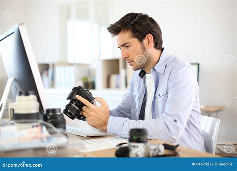 Photographer At Office Checking Shots Stock Image Image Of