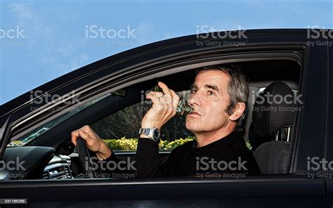 Man Drinking While Driving Stock Photo Download Image Now 2015
