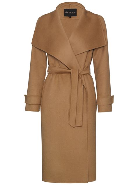 The cape is 85% wool and 15 % camel hair, it is caramel colour with black braiding around the collar and fastening. Jaeger Wool Wrap 3/4 Coat at John Lewis & Partners