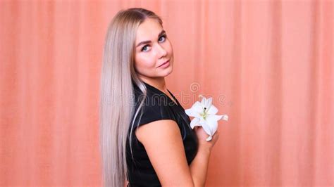 Beautiful Female With Healthy Long Straight Blond Hair Dyed Wavy White
