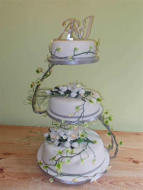 3 Tiered White Flower Wedding Cake On S Shaped Stand