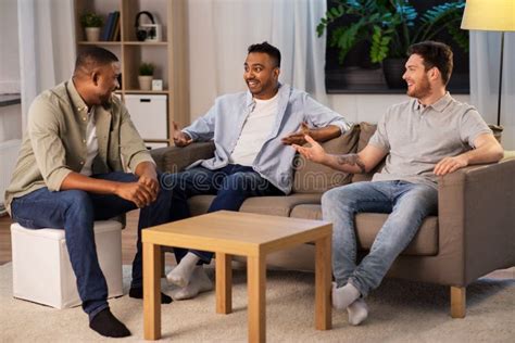 Happy Male Friends Talking At Home At Night Stock Image Image Of