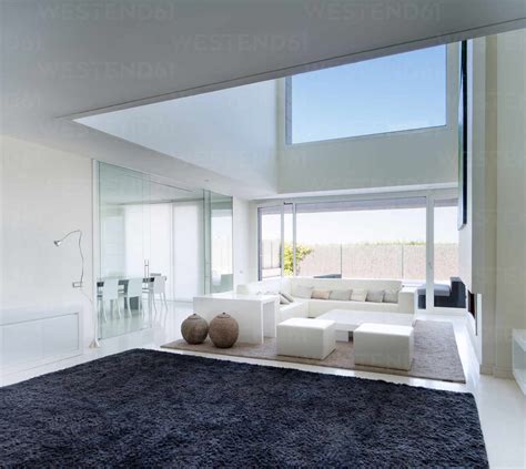 Interior Of Modern Living Room With Soft Simple Furniture And High