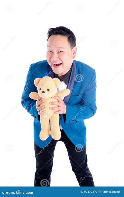Man Holding Teddy Bear And Smiles Over White Stock Image Image Of