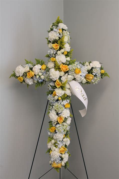 Check spelling or type a new query. Evans White Blue & Yellow Funeral Cross by Evans Flowers ...