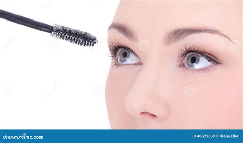 Close Up Portrait Of Beautiful Woman Applying Mascara On Her Eye Stock