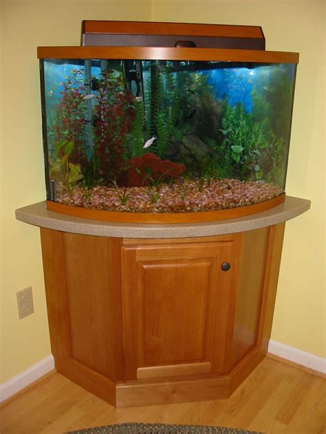 You'll find tropical fish tanks in all shapes and sizes at pets at home. Fish tank on a corner cabinet with a Corian top | Fish ...