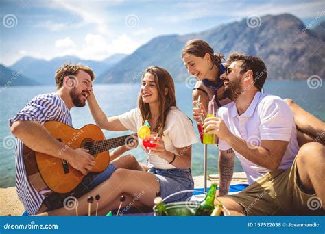 People Having Fun On Summer Vacationhappy Friends Drinking Tropical