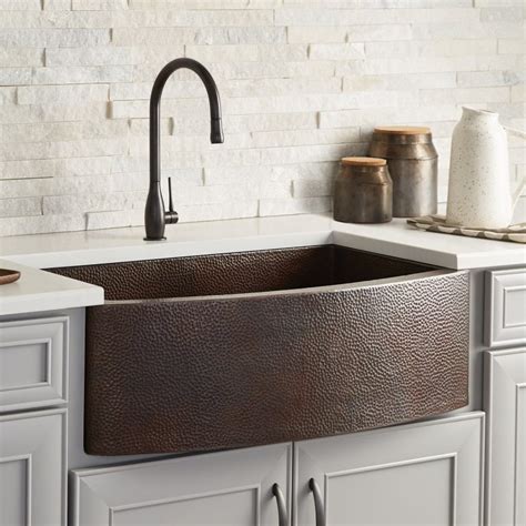 Burnished Copper Farmhouse Sink With Hammered Texture And Curved Front