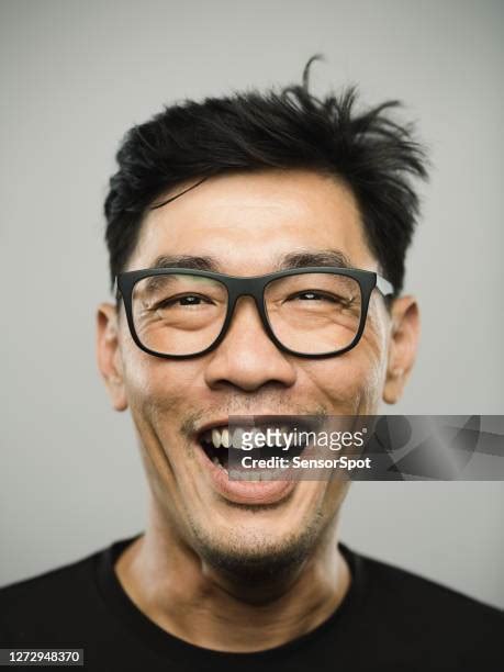 mouth open close up asian photos and premium high res pictures getty images