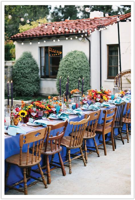 A mexican party table displays exotic cocktails, chilled margaritas, appetizers, and desserts. spanish fiesta dinner party I've always felt that white ...