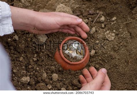 Male Pale Hand Digging Buried Treasure Stock Photo 2086703743