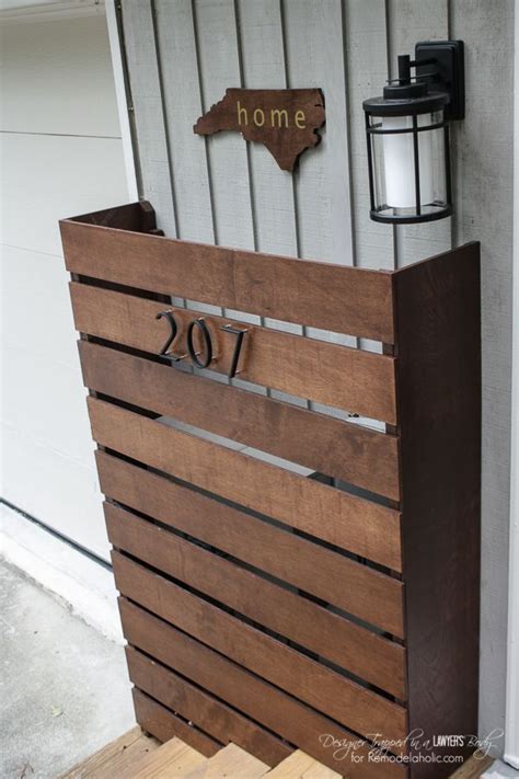 Always check with your local utility companies on policies for covering up your water meters, electrical meters, trash bins, and ac. How to Hide Your Outdoor Eyesores | Covered boxes, Wooden ...