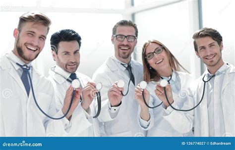 Group Of Doctors Hold Their Stethoscopes Stock Image Image Of