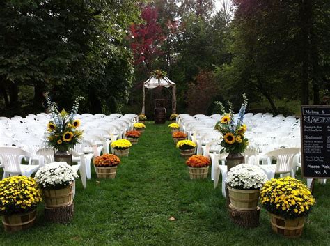 Our aisle decoration. We used 14 potted mums in bushel baskets, 2