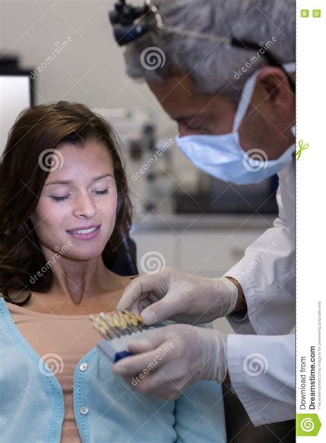 Dentist Examining Female Patient With Teeth Shades Stock Photo Image