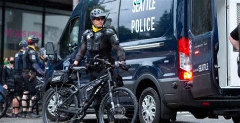 Seattle Police Officer Seen Riding Bicycle Over A Protesters Head Video News