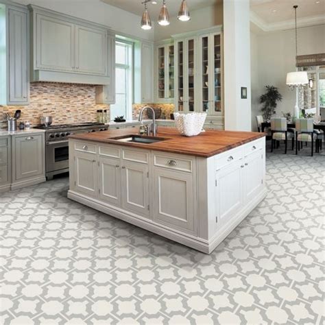 If your kitchen cabinets and countertops are white, consider a tile. Kitchen floor tile ideas with white cabinets | Hawk Haven