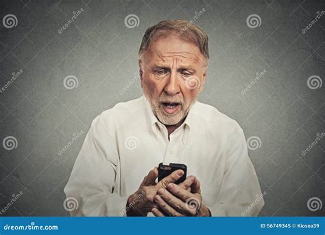 Elderly Man Shocked Surprised By What He Sees On His Cell Phone Stock