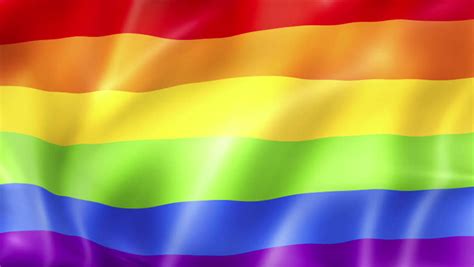 De regenboogvlag, het internationale symbool van de homobeweging, wappert de rest van de week op het stadhuis in amsterdam. lgbt background | Background Check All