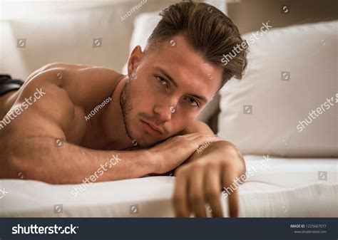 shirtless sexy male model lying aloneẢnh có sẵn1225667077 shutterstock