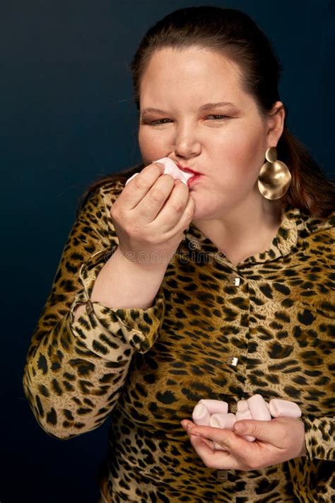 Fat Girl Eating Fast Food With An Appetite In The Hand A Bitten Donut Leopard Blouse