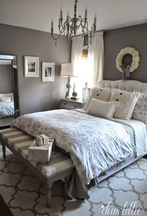 Ivory and gray bedroom features an ivory bed dressed in white and blue bedding, with ivory curtains behind bed, flanked by a gray desk as nightstand to the left and a gray chest as nightstand to the right illuminated by turquoise blue glass. 27 Amazing Master Bedroom Designs To Inspire You | Home ...