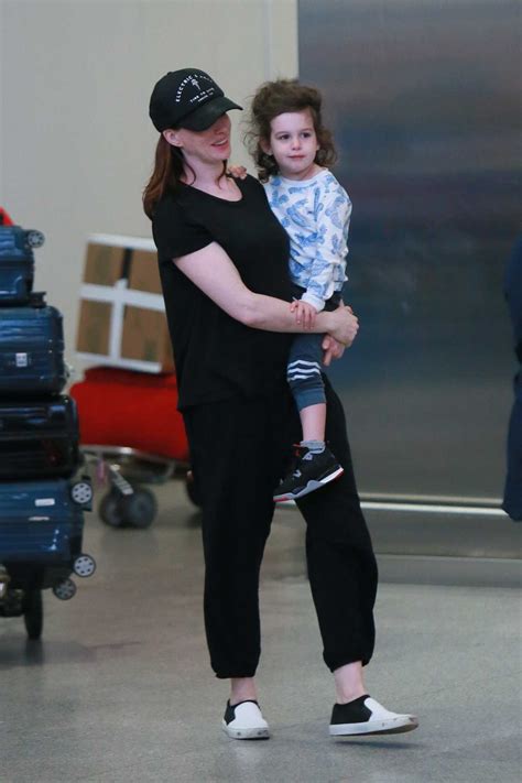 Anne Hathaway Out With Her Son Jonathan Arrives At Jfk Airport In New