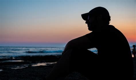 Premium Photo Silhouette Teen Sitting At The Beach In Peace