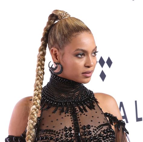Beyonce Rocking A Black High Neck Gown Statement Earrings And A High