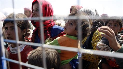 raids by isis push flood of refugees into turkey the new york times