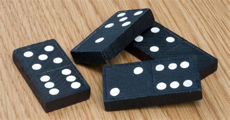 The game is said to be so called from the black under surface or part of the pieces with which it is played. Domino - Wikipedija